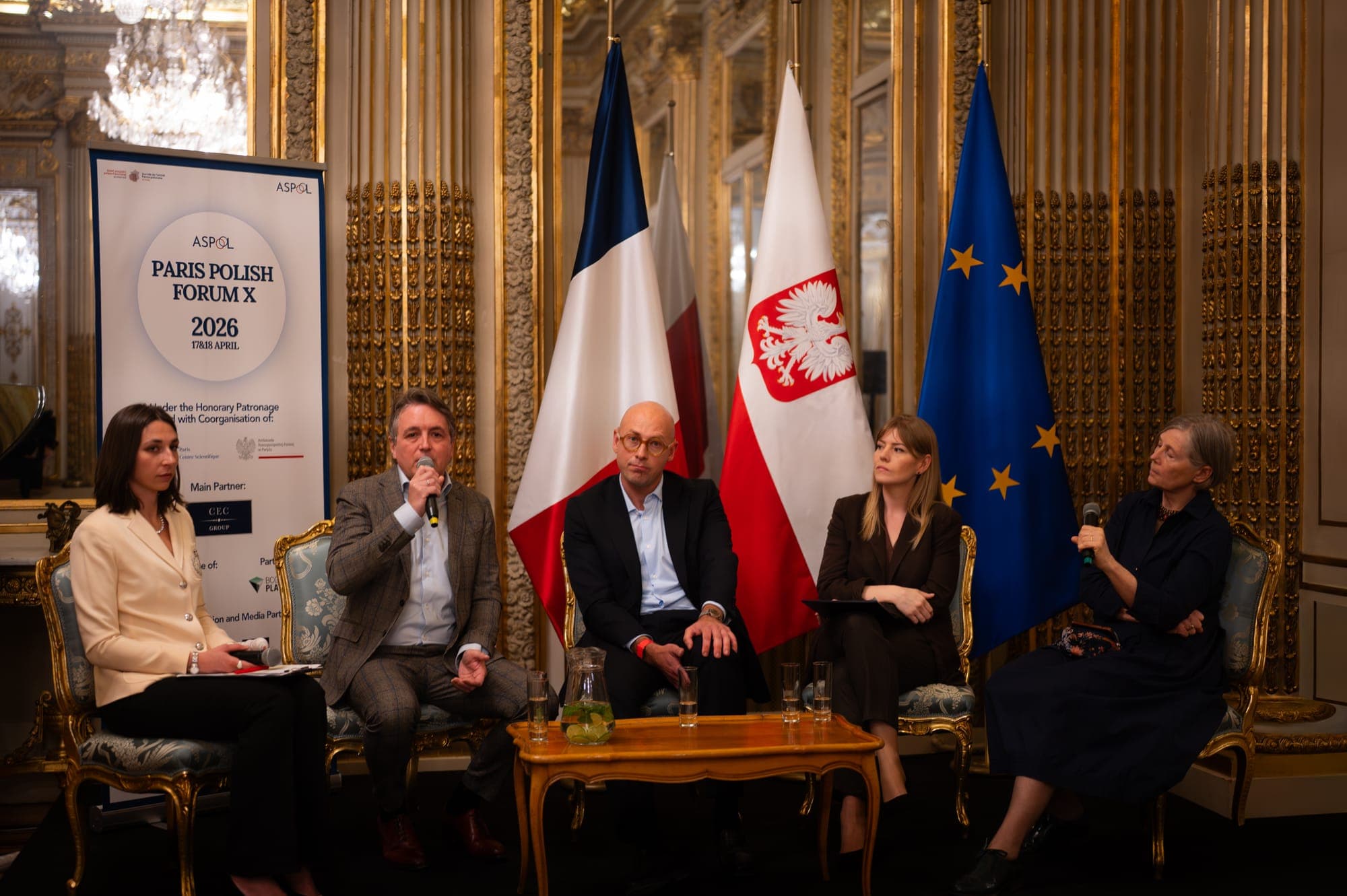 Panel discussion in front of French, Polish and European flags at Paris Polish Forum X