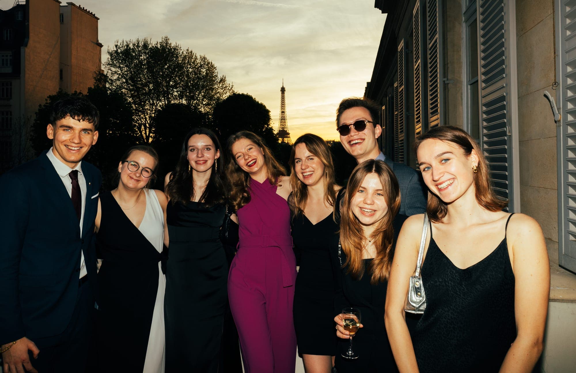 Friends with drinks on the terrace at dusk